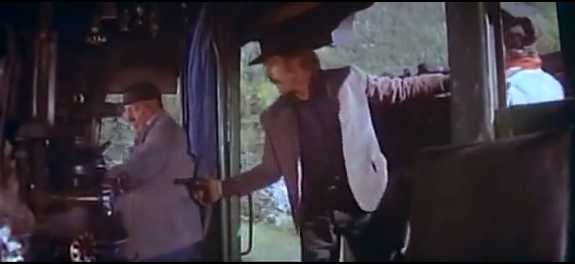 The Sundance Kid holds a gun on the Engineer. A Fireman is on the right edge of the scene.