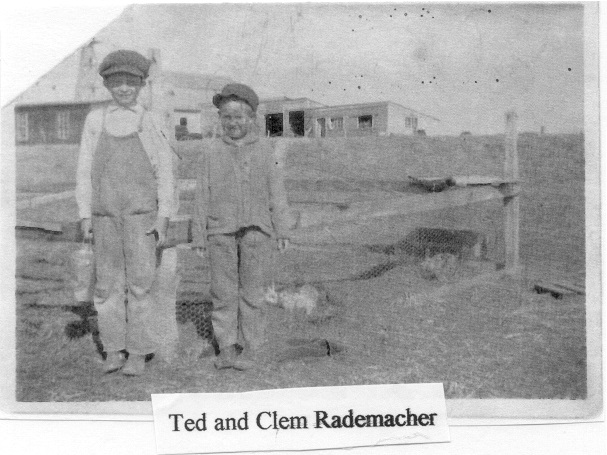 Ted and Clem Rademacher in front of their rabbit pen (photo from Paul and Kay Rademacher)